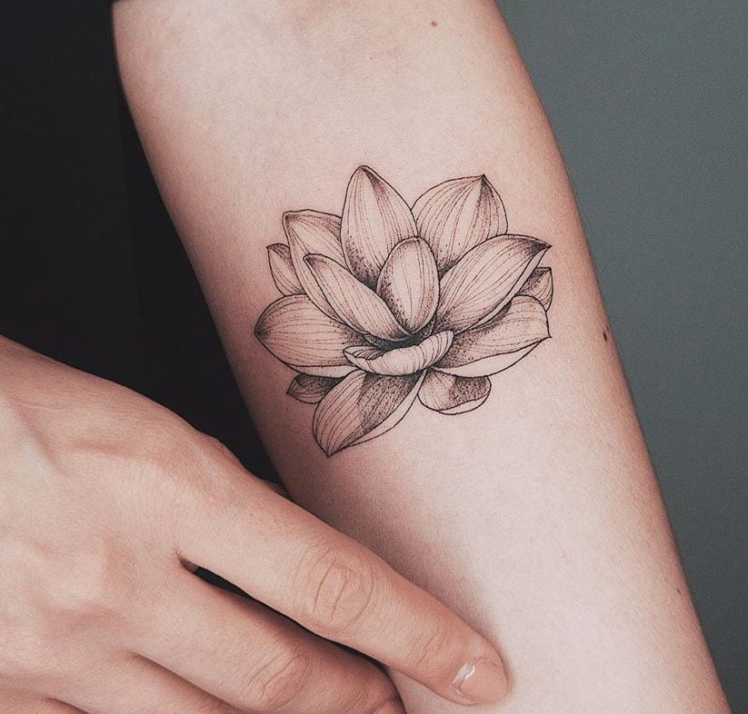 small lotus flower tattoo on foot